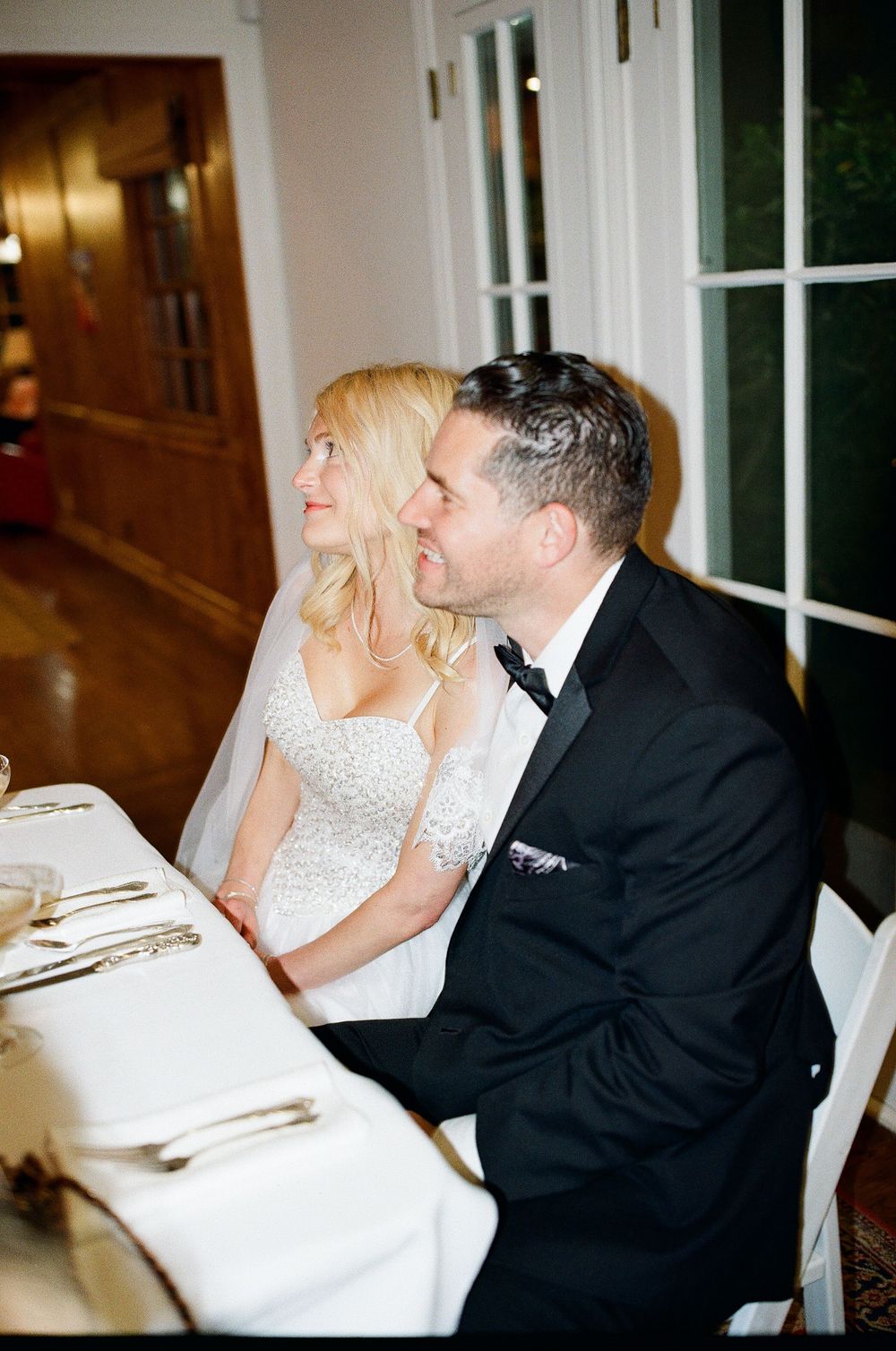 Cinematic direct night flash portrait at a Hope Ranch wedding. Nostalgic 90s aesthetic by an NC photographer.