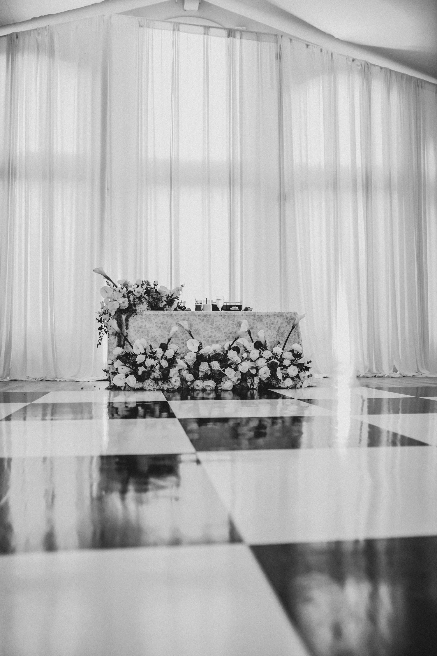 Black and ivory wedding reception décor at Brighton Abbey