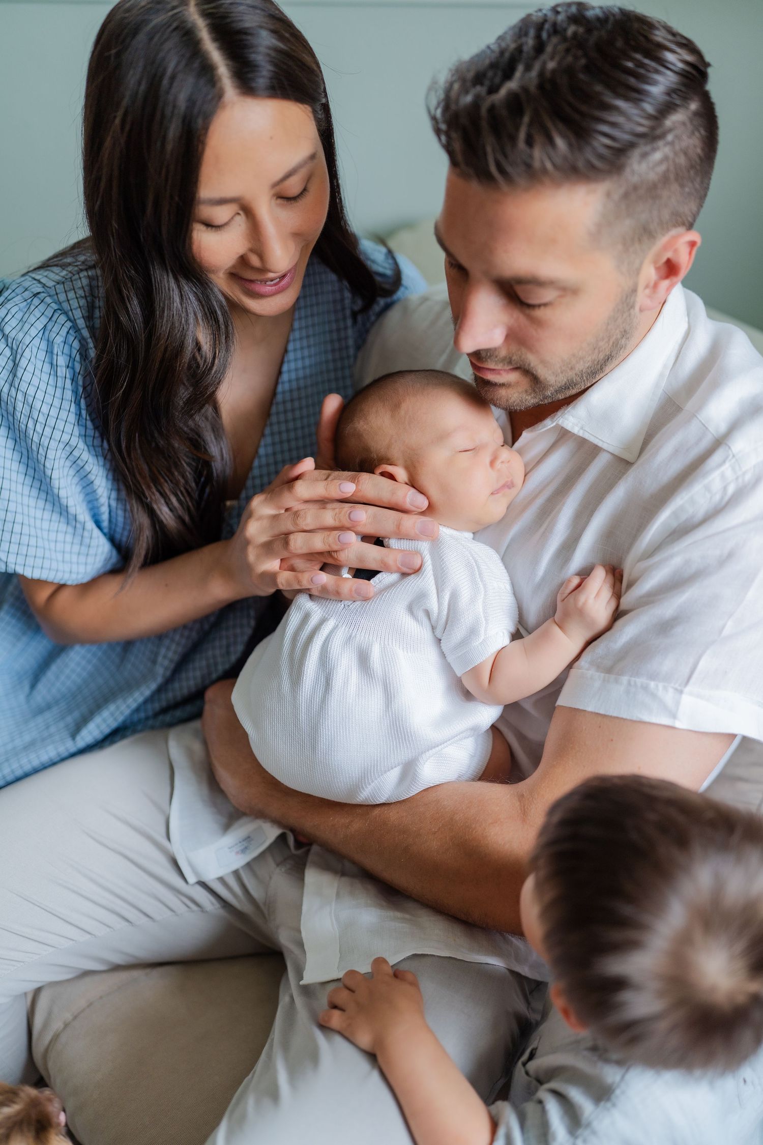 newborn family photo session in nursery mom wearing baby blue dress