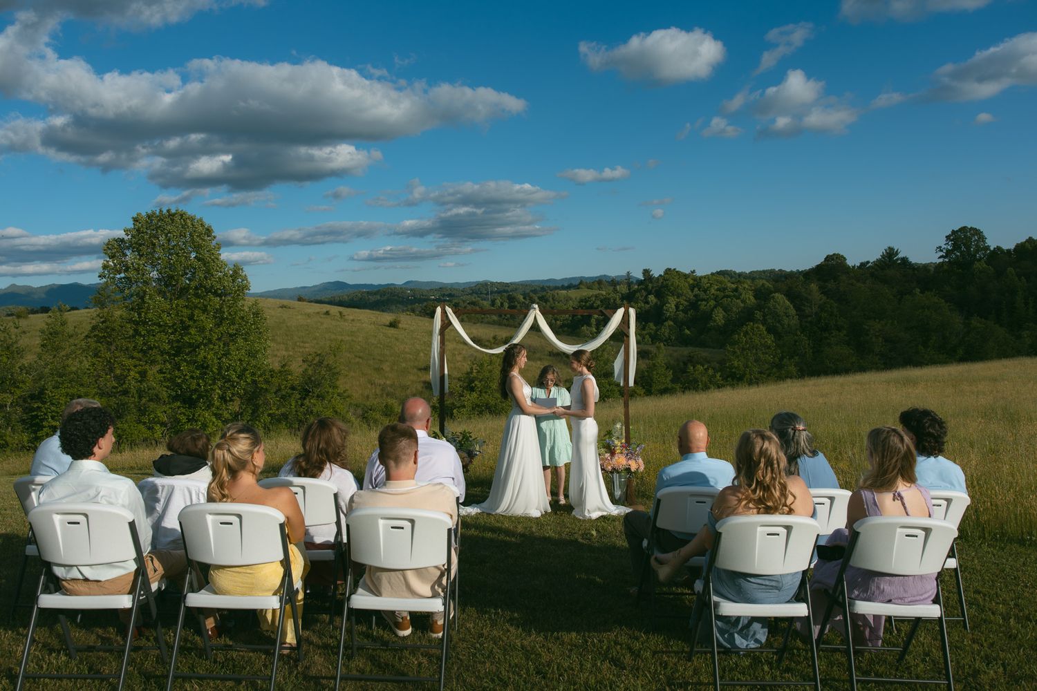 asheville nc microwedding ceremony brides at alter mountain backdrop