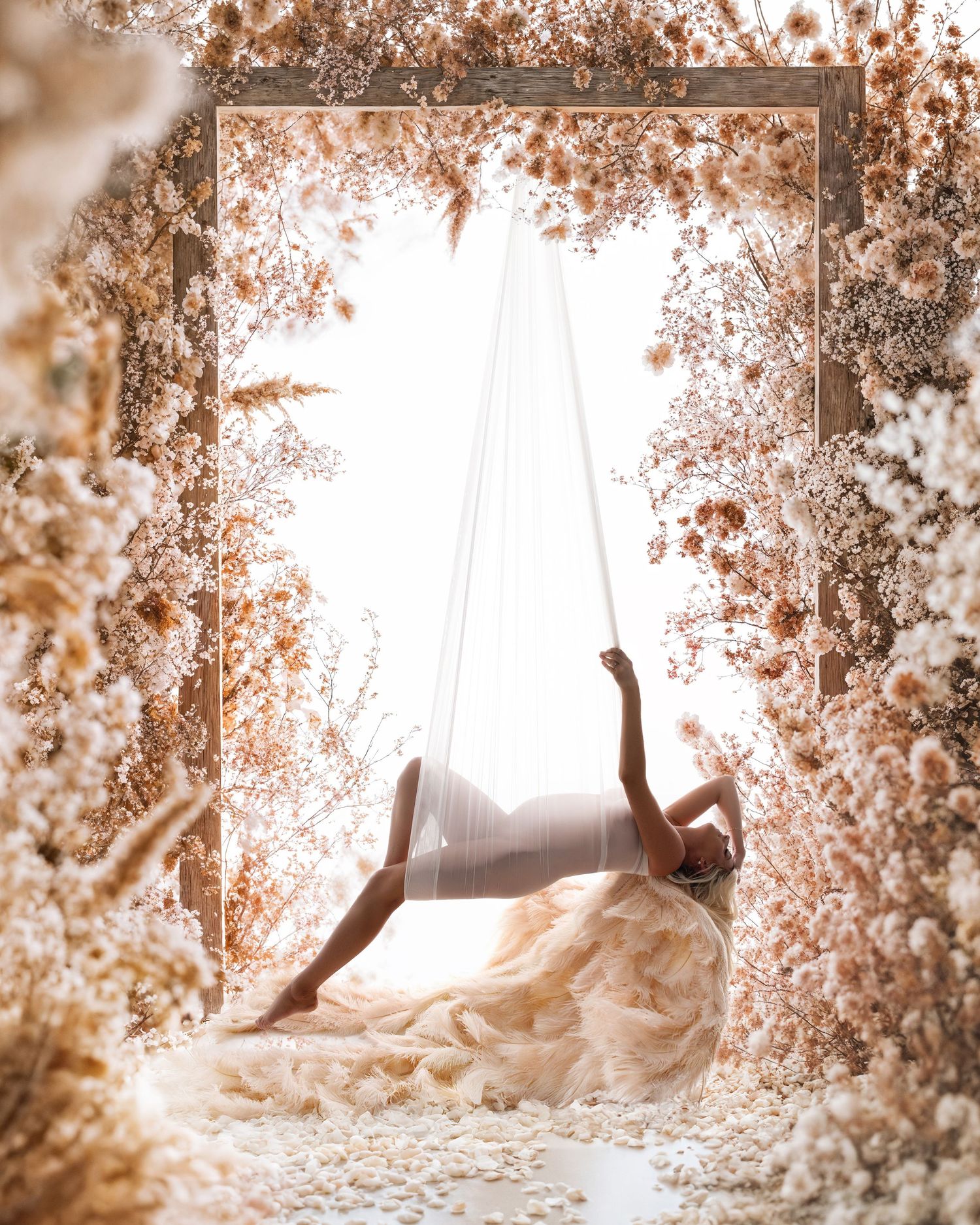 A flowing white dress billows gracefully through a dreamy autumn scene with golden leaves and soft lighting.