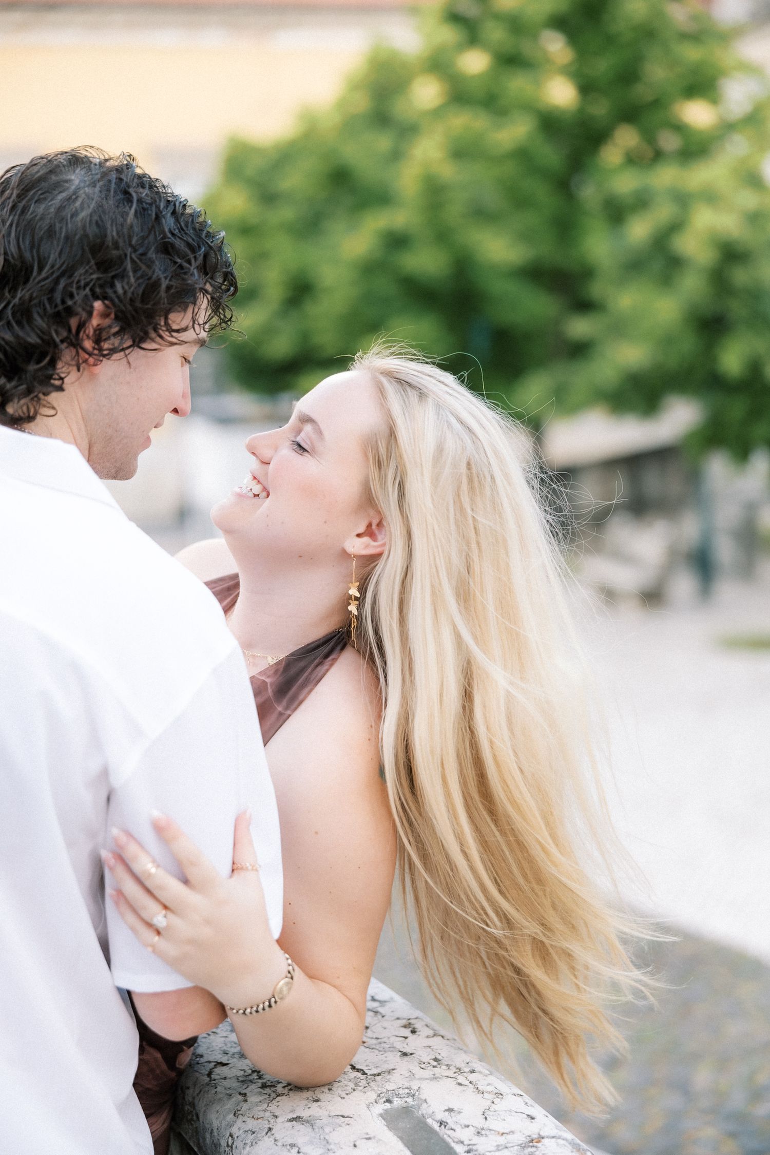 Couple laughing together while exploring Lisbon before their wedding day