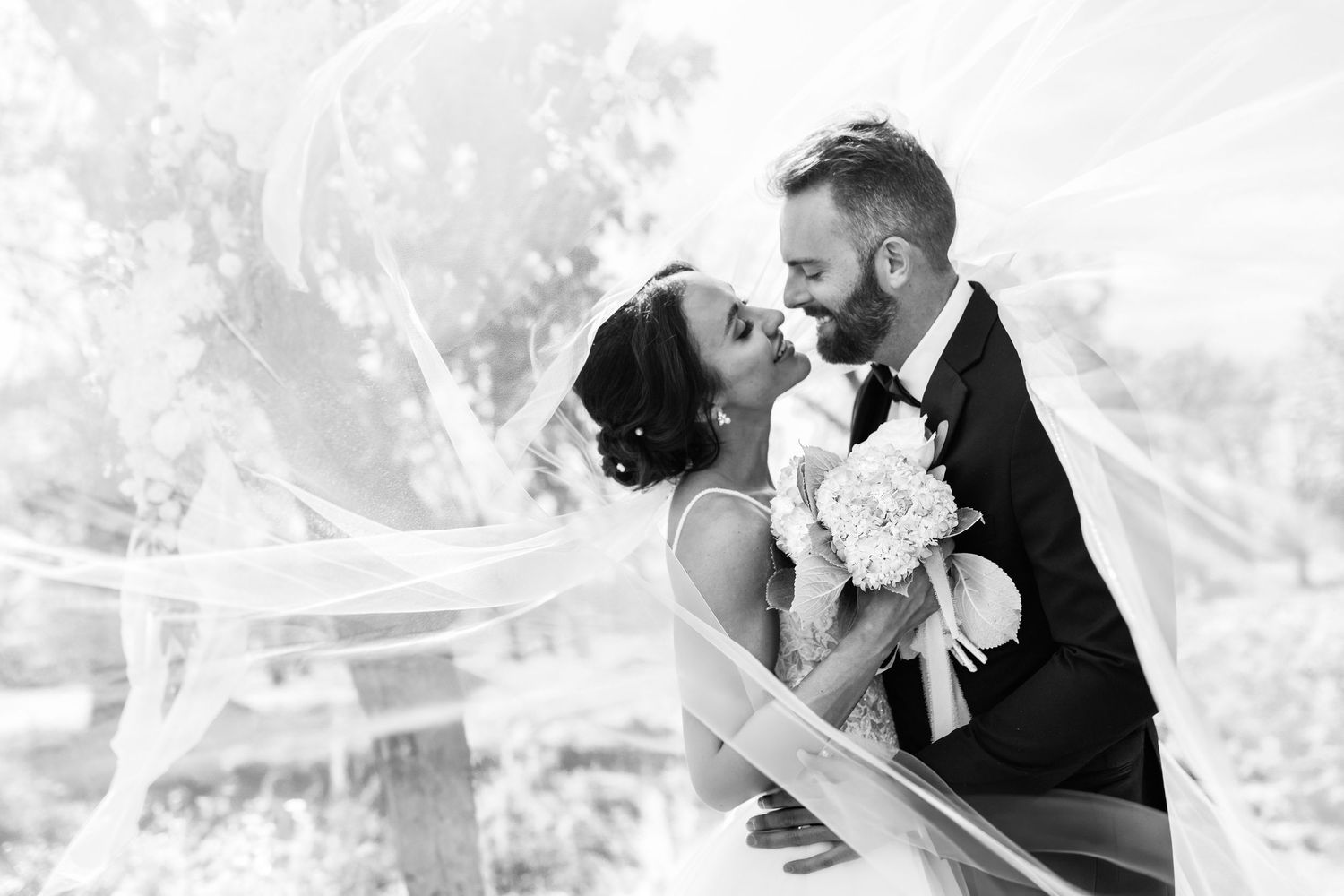 husband and wife hold hands outside of their wedding venue in deep ellum