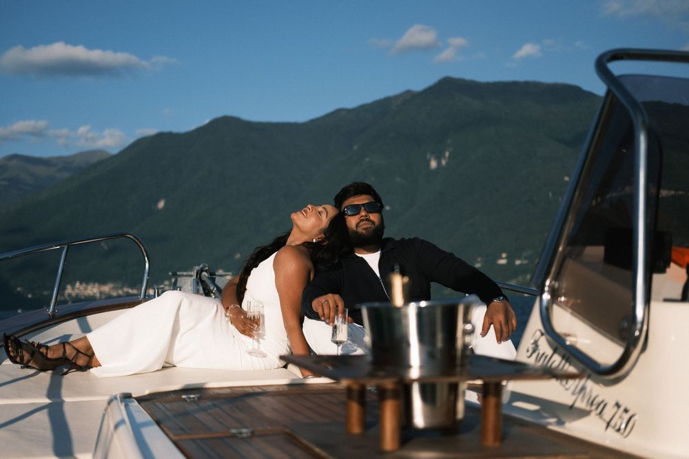 Elegant couple on private boat for Lake Como engagement photoshoot.