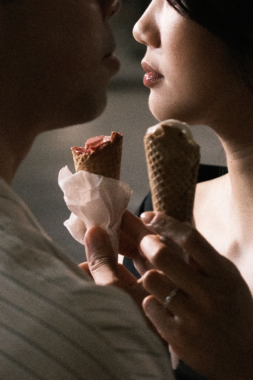 Close-up of couple sharing gelato — candid Milan couple photoshoot, romantic cinematic portraits.