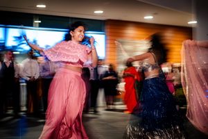 Wedding guests perform choreographed dances for the wedding couple at the reception, held at The Shelburne Museum in Vermont