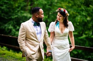 wedding couple strolls in the rain during their First Look at the Lake Bomoseen Lodge in Castleton, Vermont