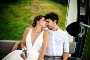 wedding couple embracing during their gondola ride from the ceremony to reception at Stratton Mountain Resort in Vermont