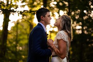 wedding couple portrait in the woods during golden hour