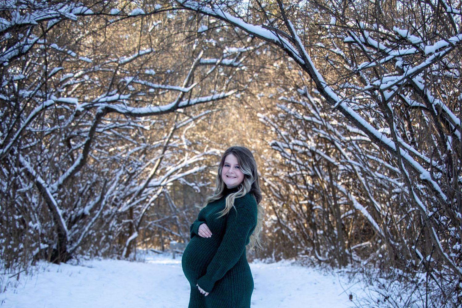 Snowy maternity session at Rentchler Park in Cincinnati capturing expecting parents in a winter wonderland with high-end, elegant styling