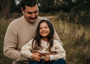 A heartwarming sequence of candid outdoor photos showing tender moments between a couple in cozy sweaters.
