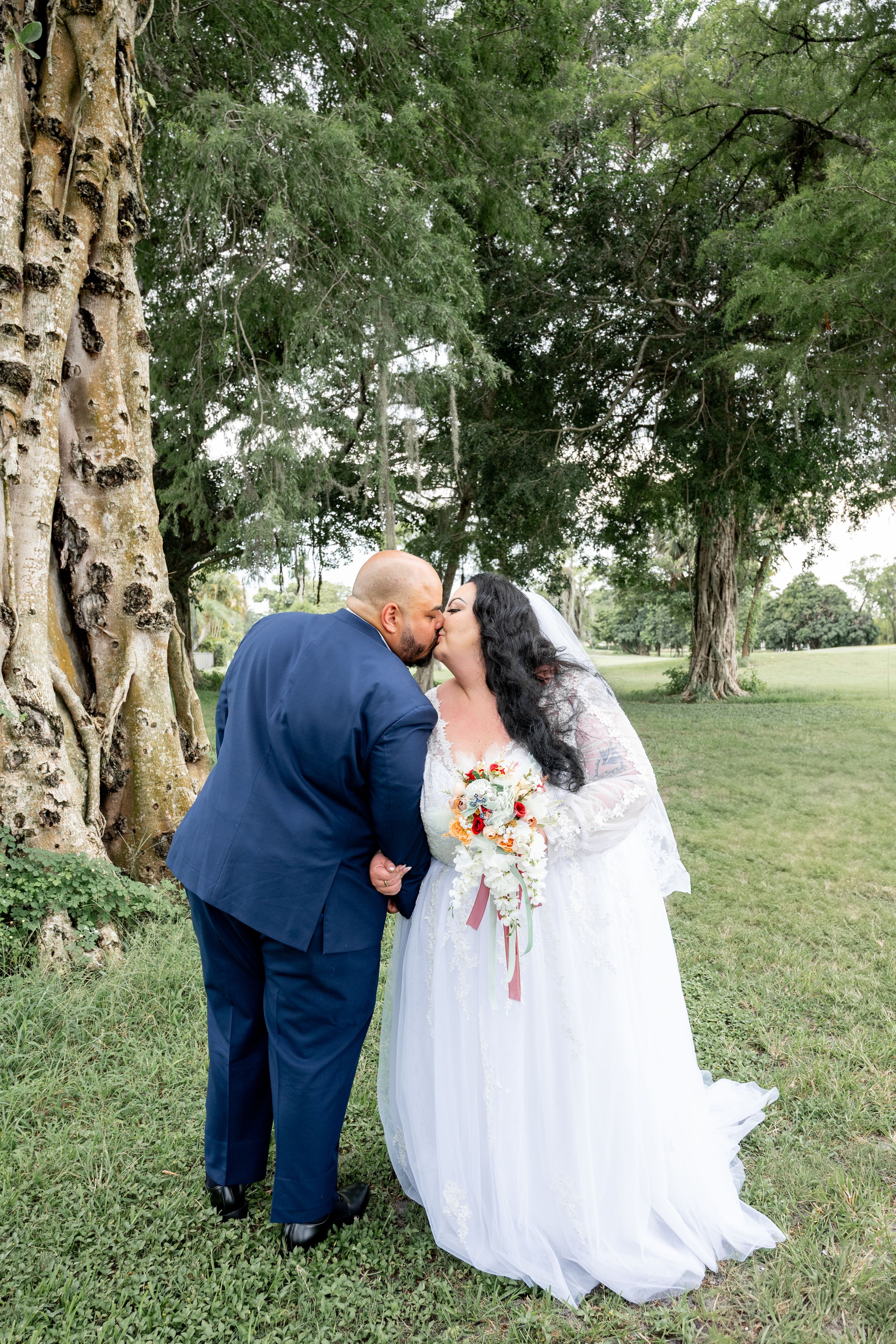 Wedding photography session in a natural outdoor setting with birch trees.