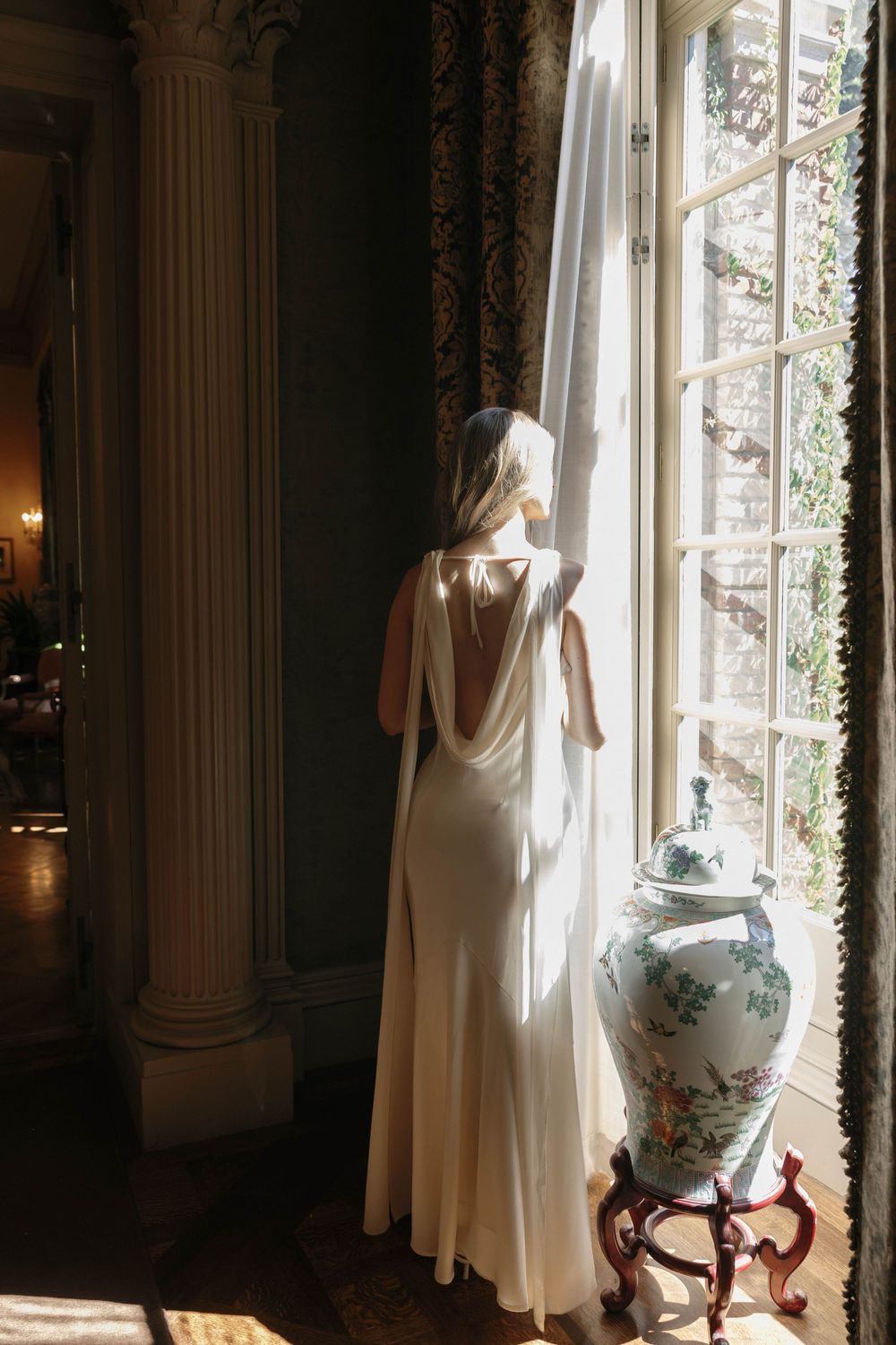 Bride and groom in elegant attire at Filoli Gardens, Woodside CA, during a romantic summer engagement session