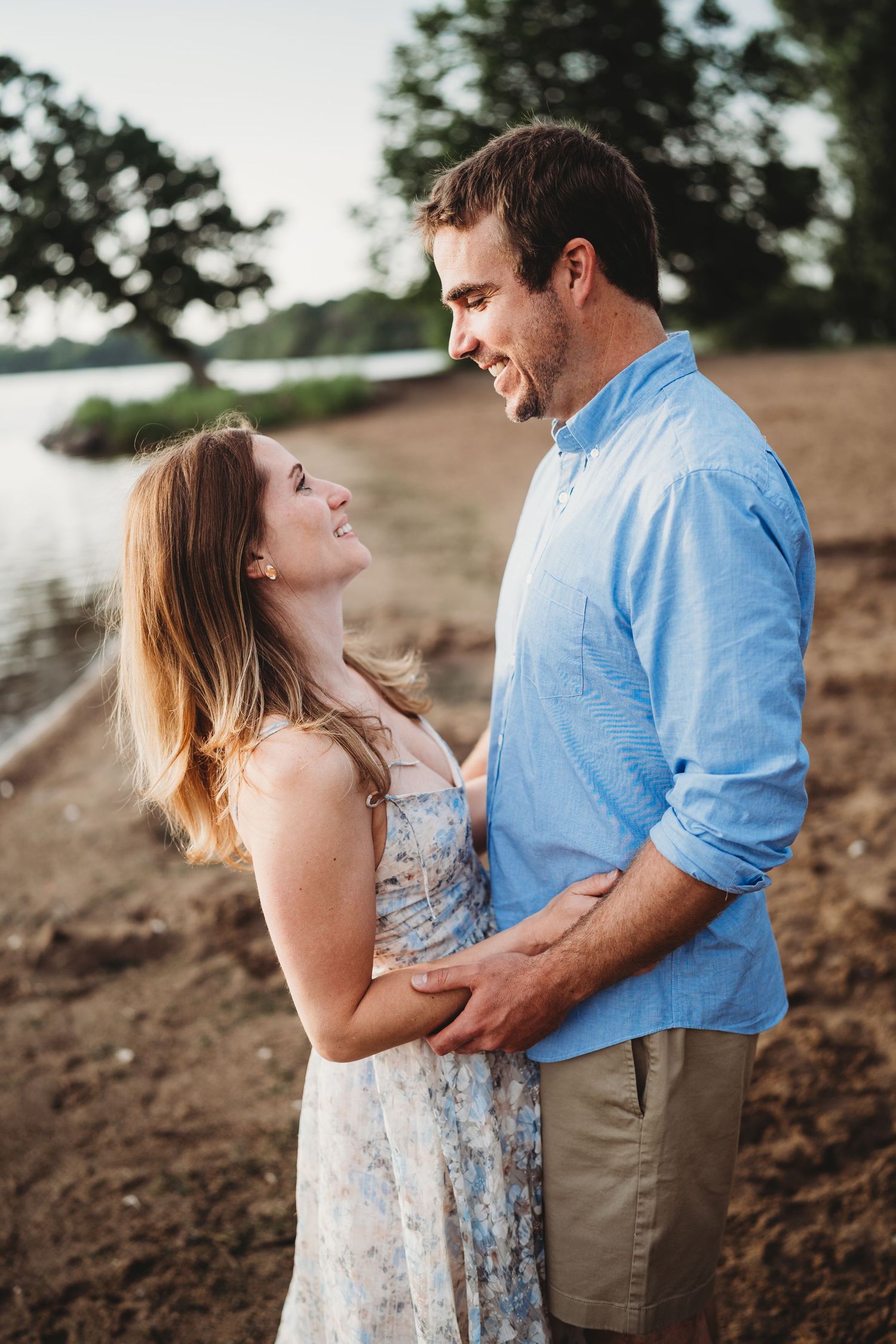 Romantic couple photoshoot against a natural outdoor backdrop at golden hour.