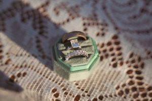 Diamond engagement ring photographed on vintage lace doily.