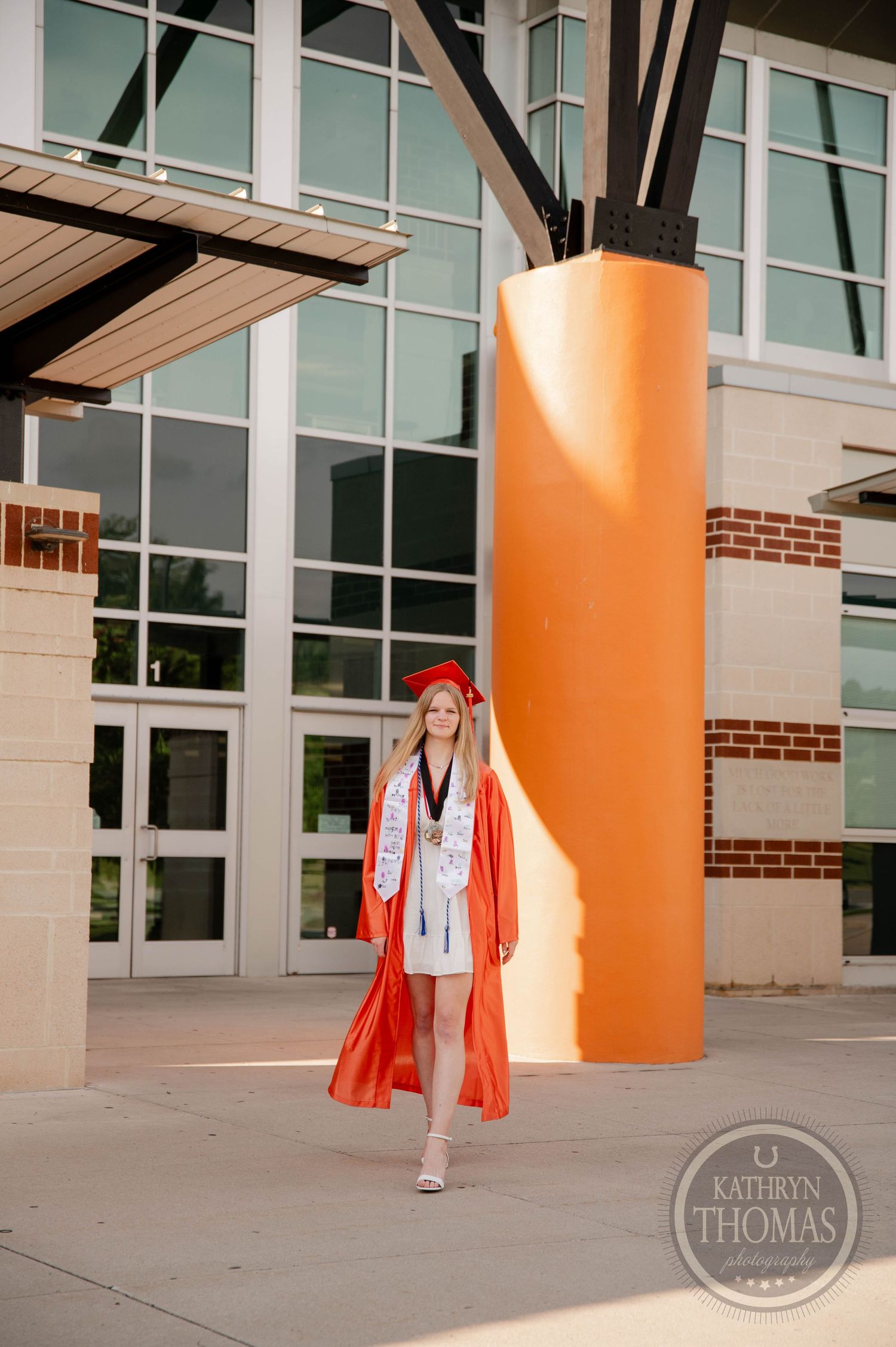 Three connected outdoor architectural photos show orange columns and glass windows on a modern building exterior.