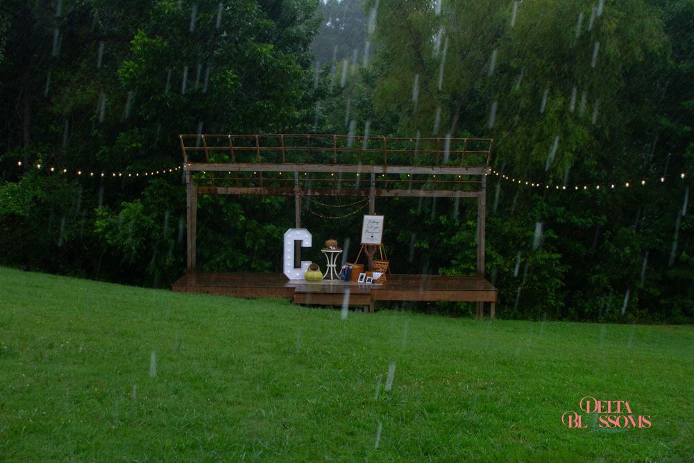 a rustic stage, decorated for an upcoming proposal on a rainy day in Paragould, Arkansas
