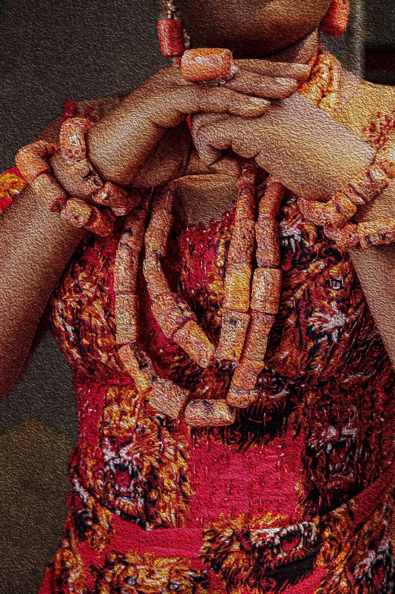 Photography Oil painting  Detailed view of beaded necklaces and red patterned dress in warm tones worn by the Igbo bride.