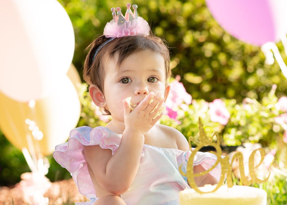 Children's photographer captured a child's portrait during first birthday and cake smash photo sessions.