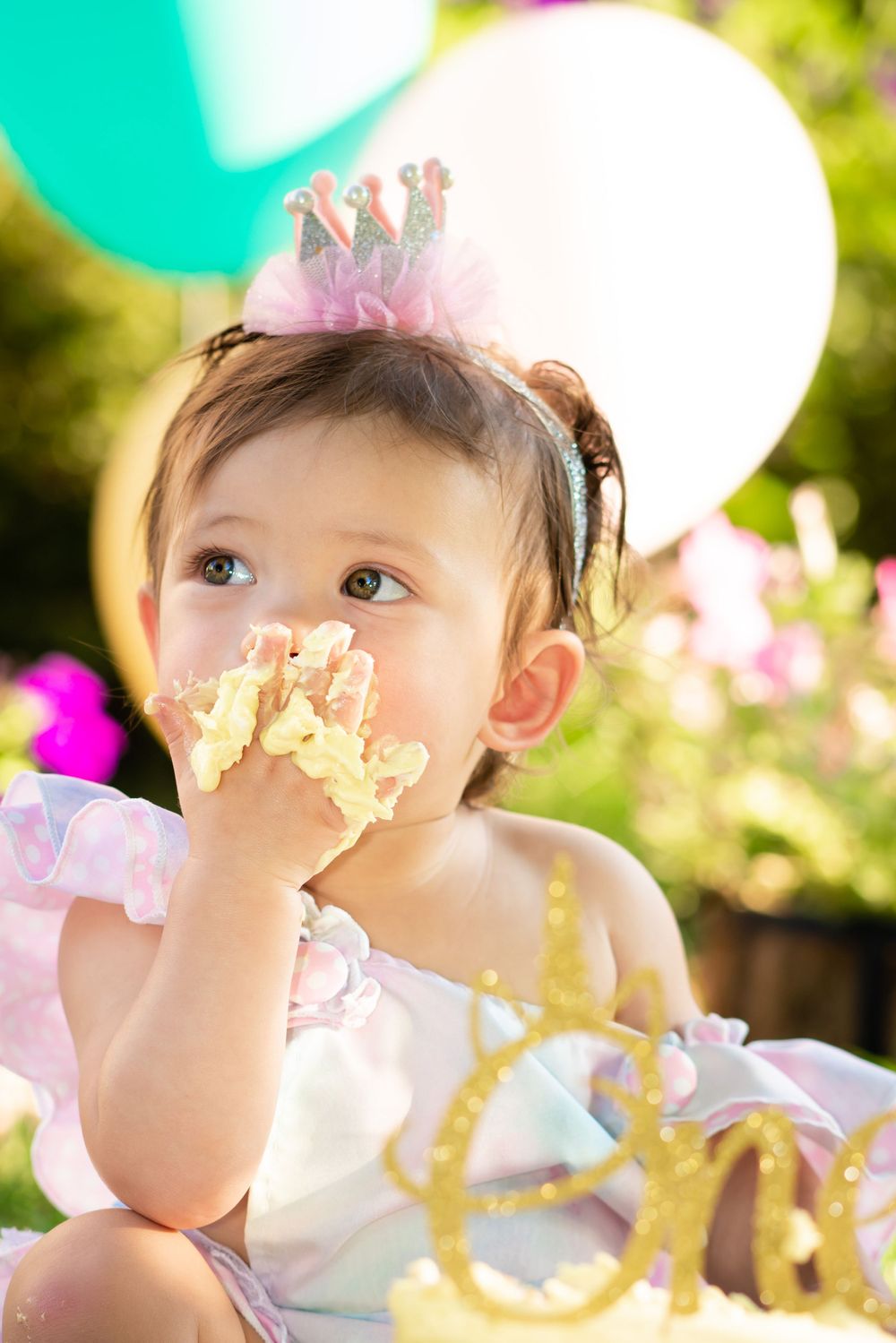Children's photographer captured a child's portrait during first birthday and cake smash photo sessions.