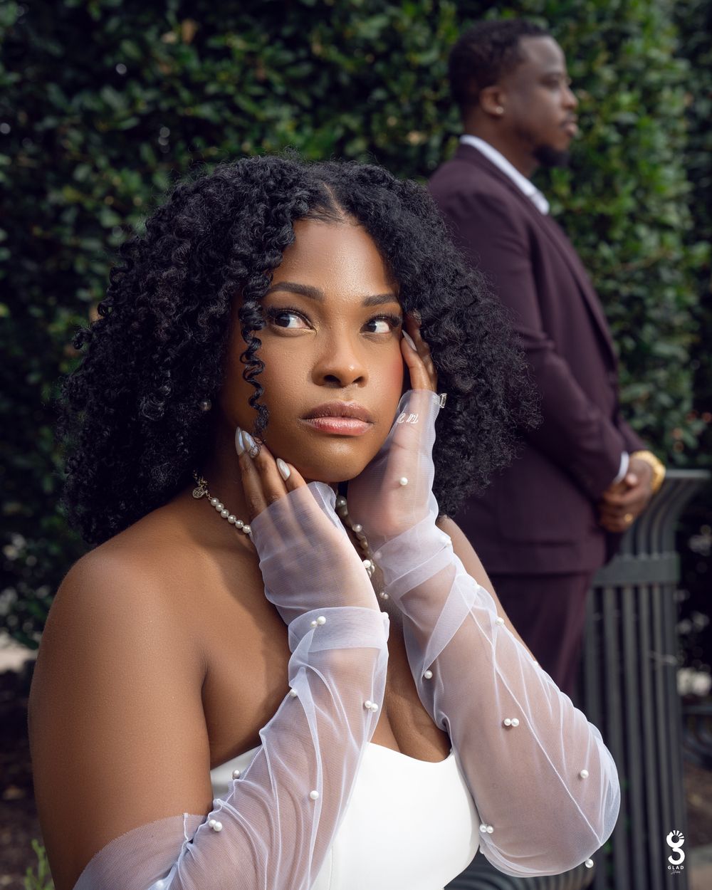 A series of artistic portrait photographs showing a person in a white off-shoulder top against a green garden background.