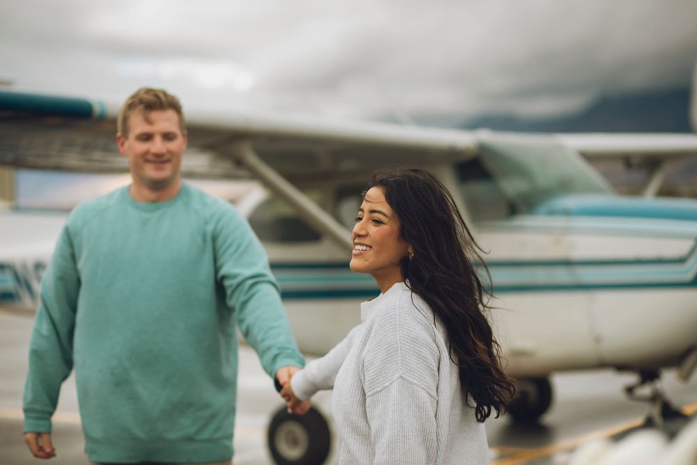 Couple smiling and holding hands.