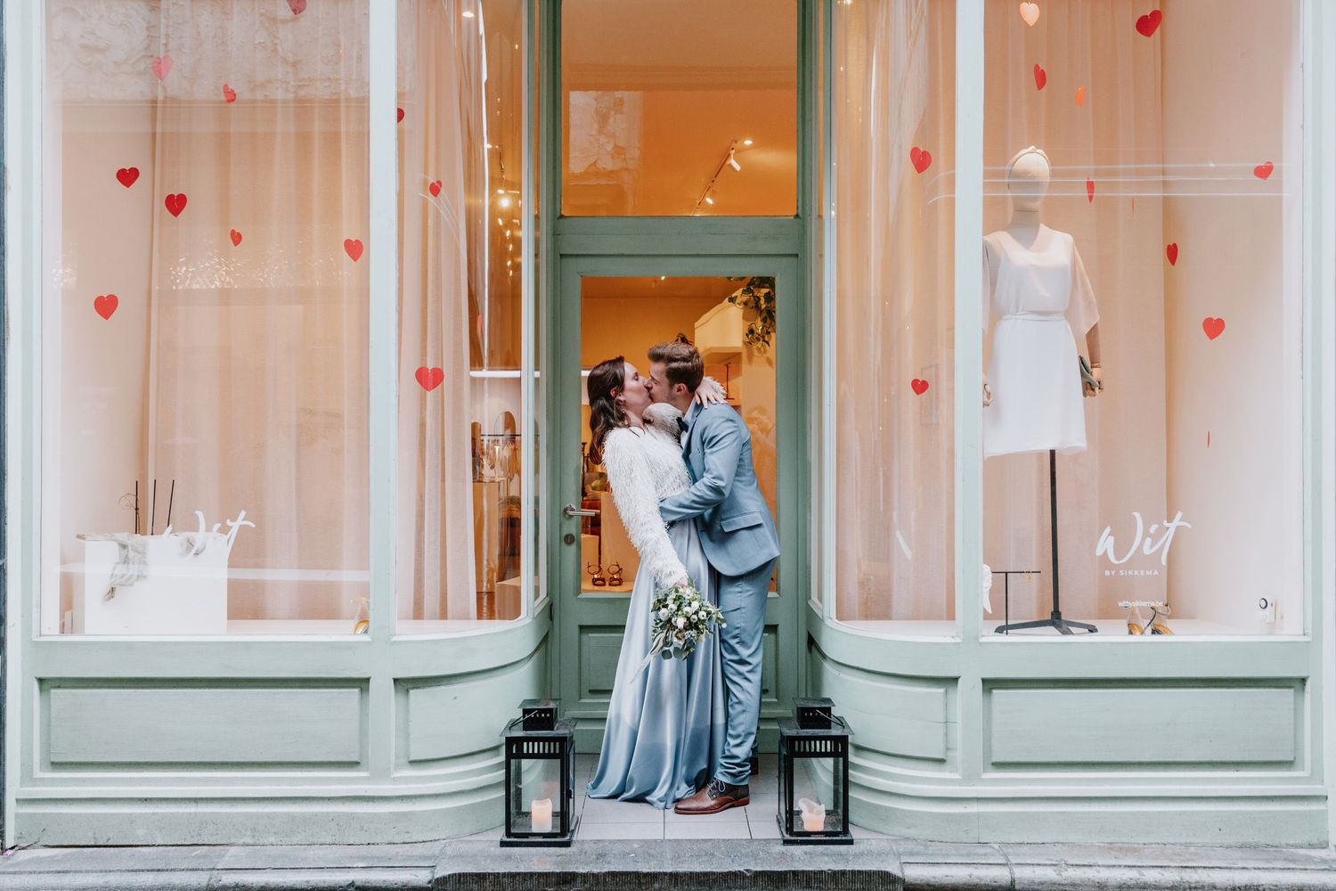 Valentine's Day window display with heart decorations and romantic vintage styling.