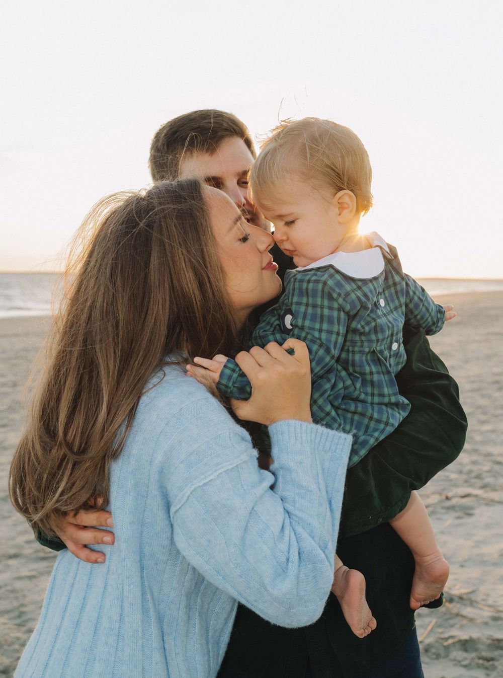 A heartwarming sequence of four tender moments captured at sunset on a sandy beach.