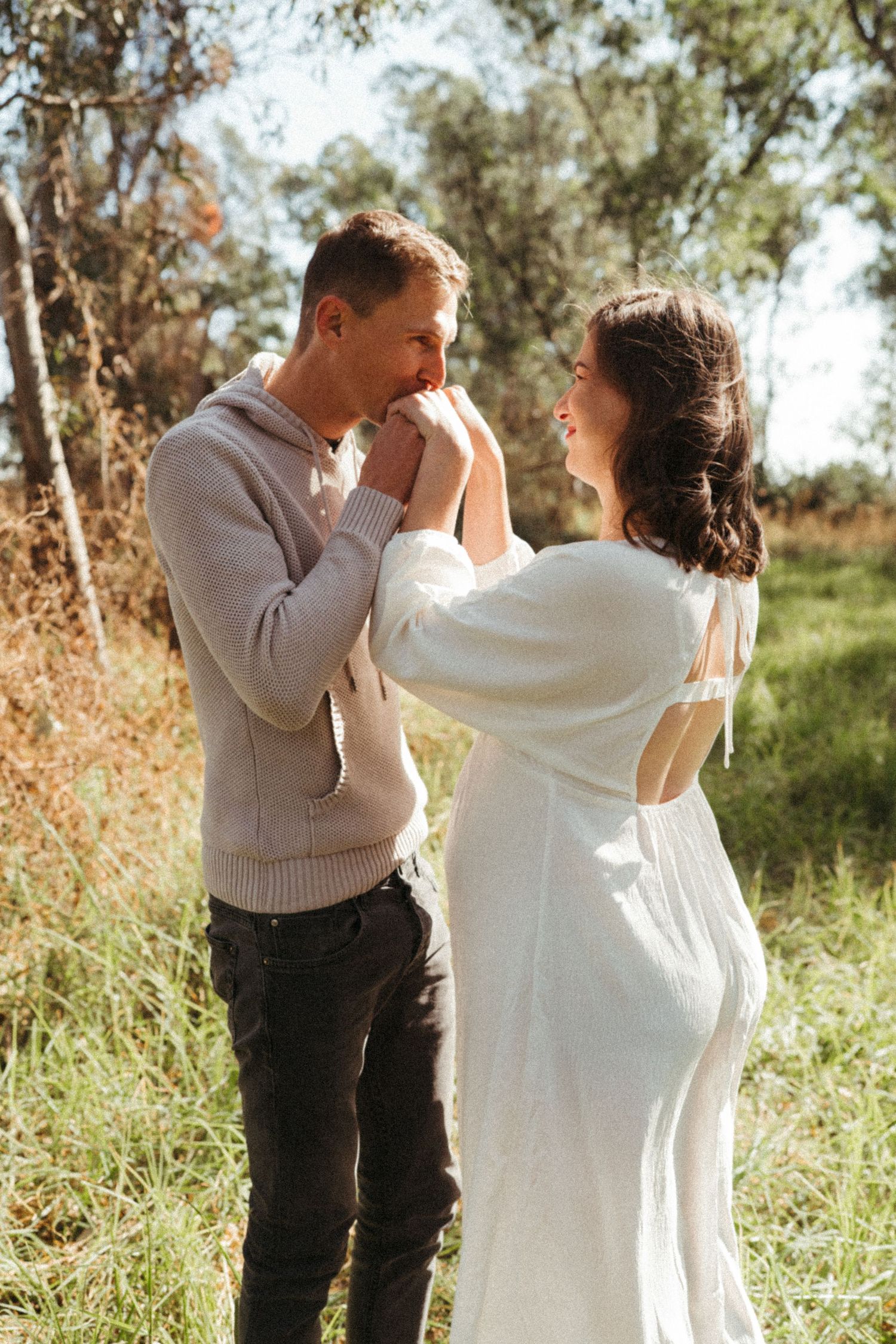 Intimate couple portraits captured in sequence showing tender moments in nature.