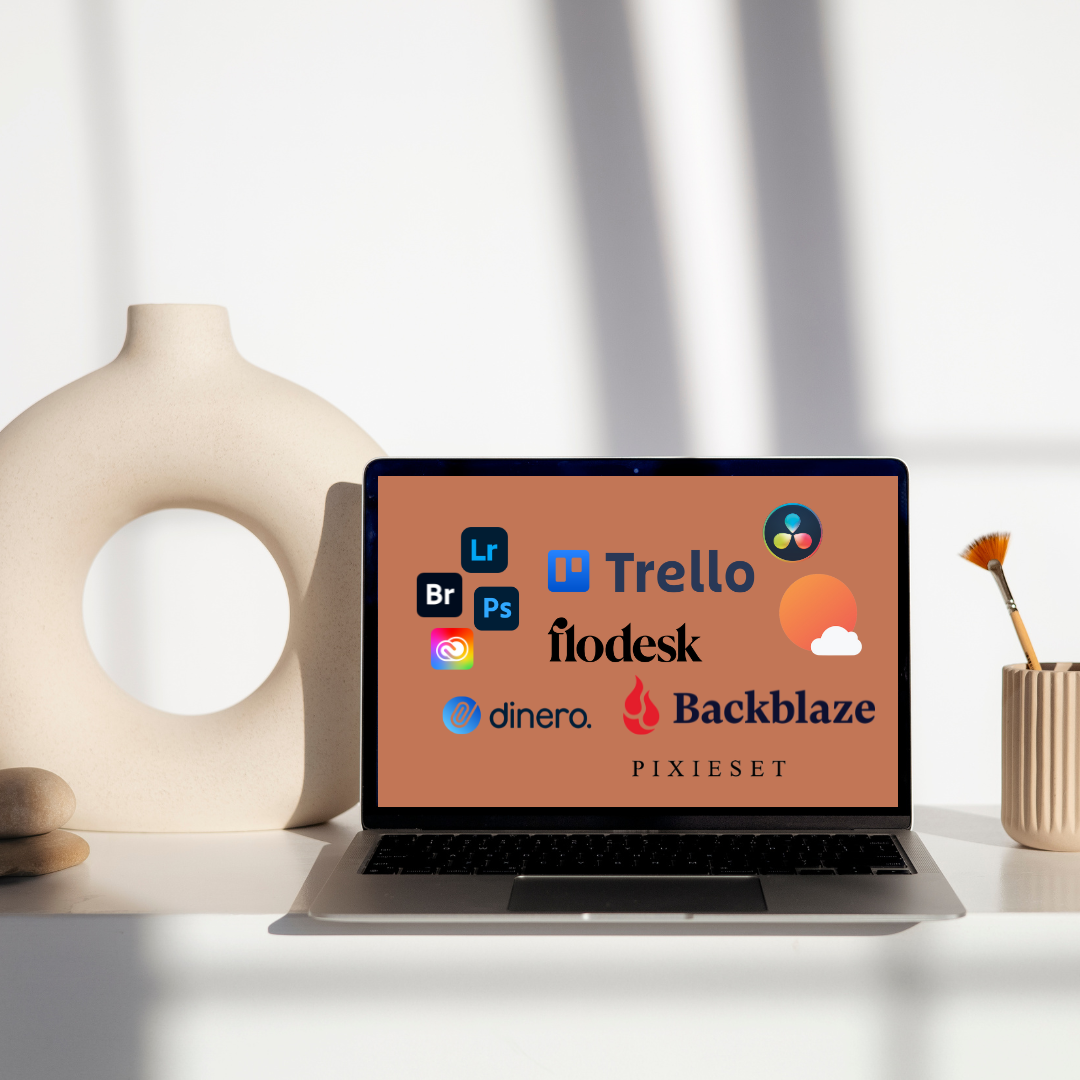 Laptop displaying various productivity app logos including Trello and Backblaze on minimal desk setup.