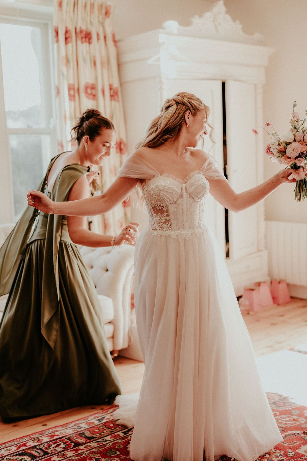 A sequence of photos showing a flower girl in a dark dress twirling beside a white wedding gown. Cornwall wedding photographer