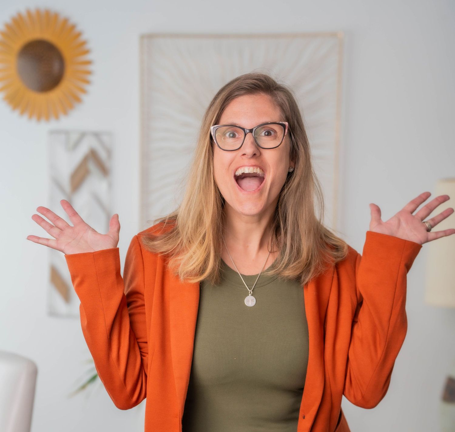 Playful lifestyle photos showing someone in an orange blazer making expressive faces.