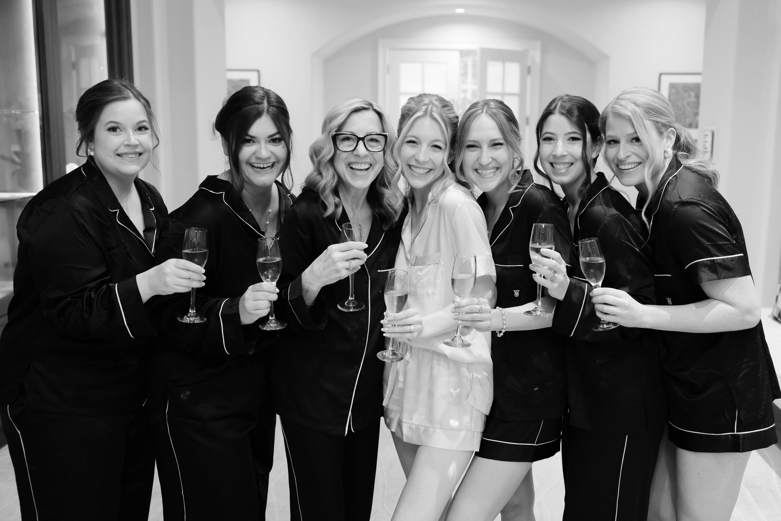 Bride with bridesmaids at BallenIsles Country Club in Palm Beach during a wedding photographed by Ohio photographer Tom Forrest.