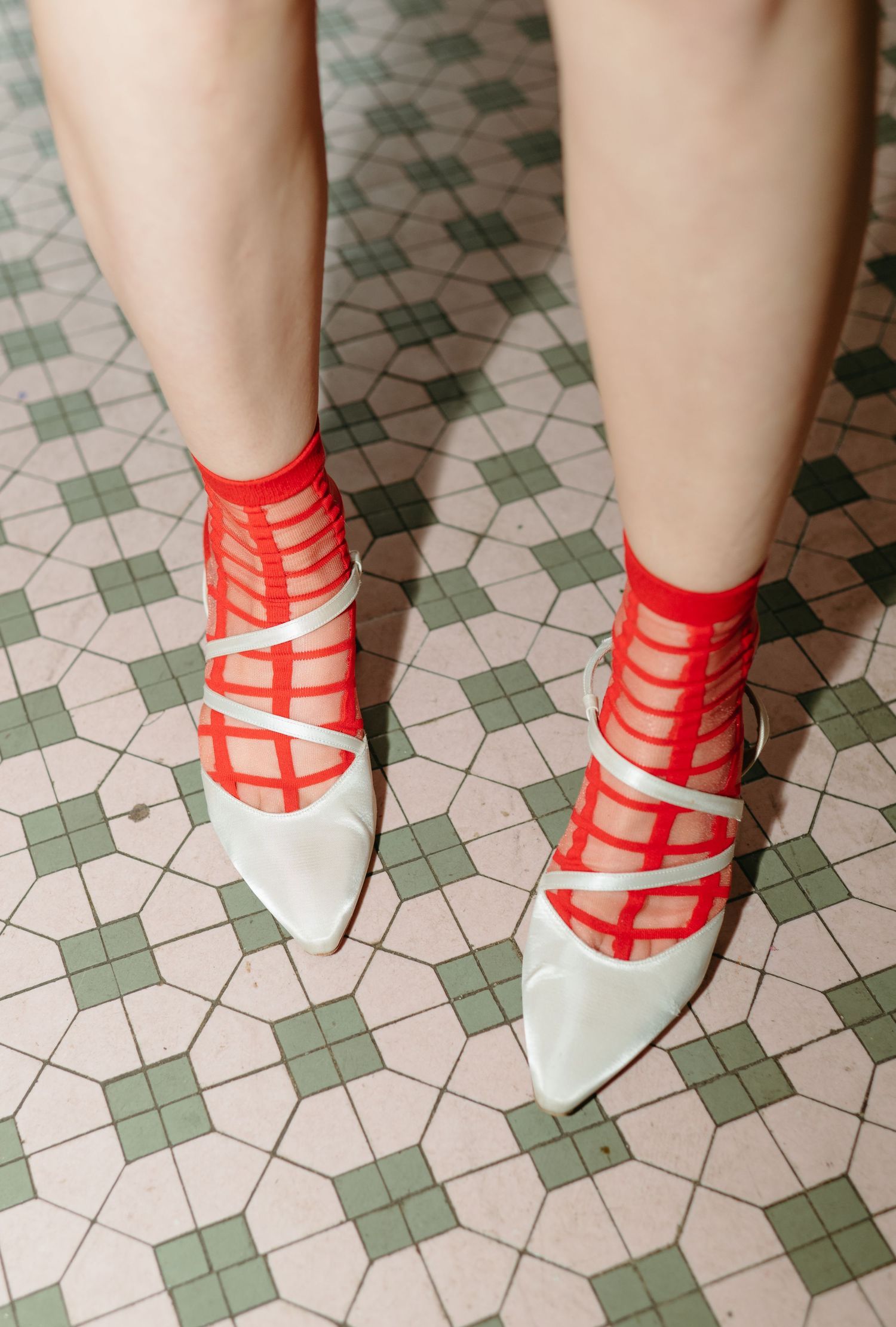 White heels with red patterned socks styled for a NYC branding photography session