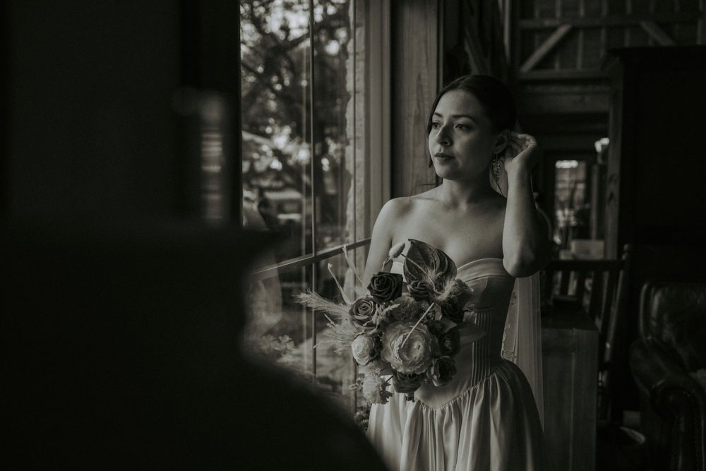 Elegant wedding ceremony setting with natural light streaming through windows.