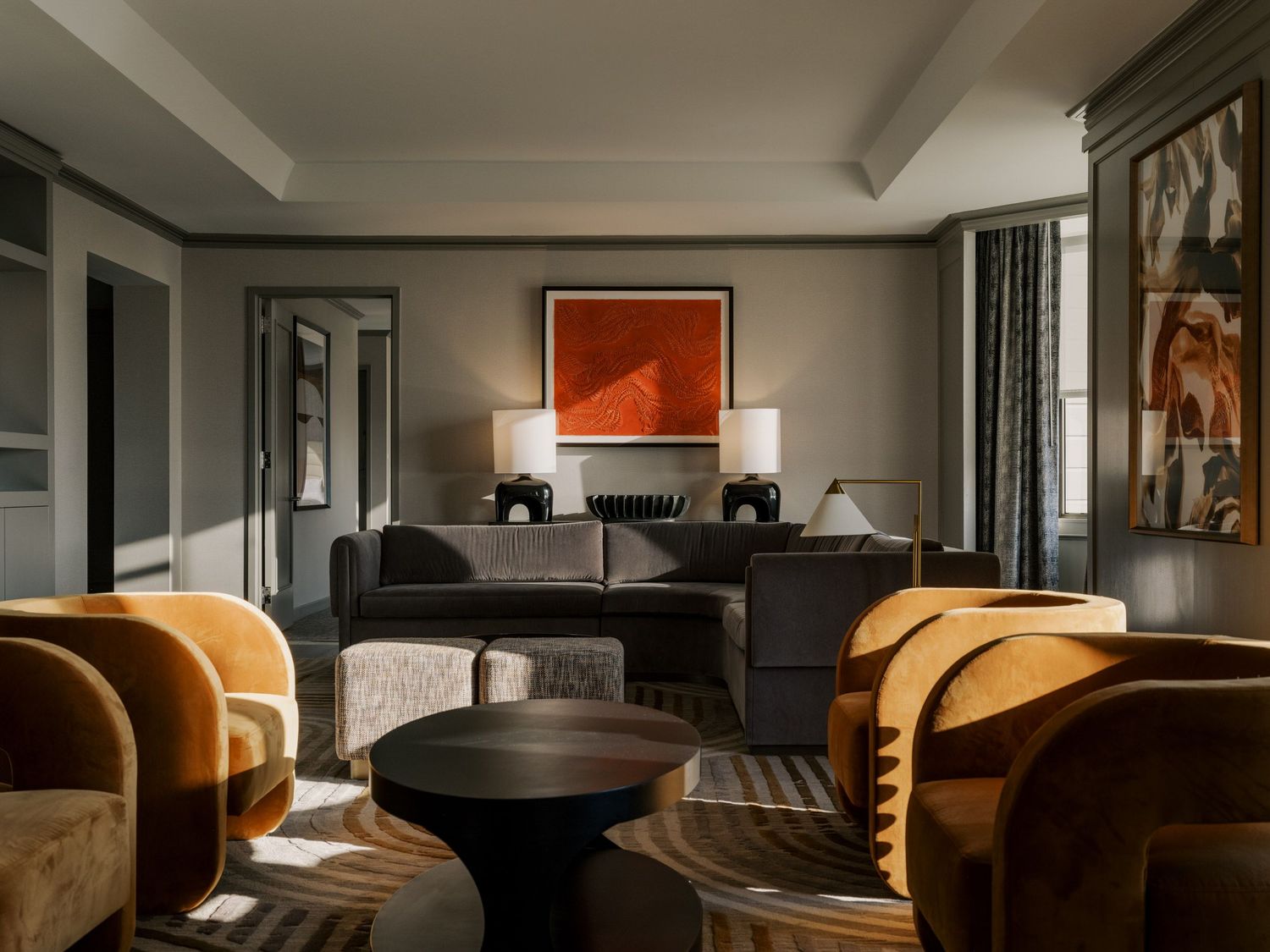 Modern office interior with dark wood furniture and warm lighting creates an elegant professional atmosphere.
