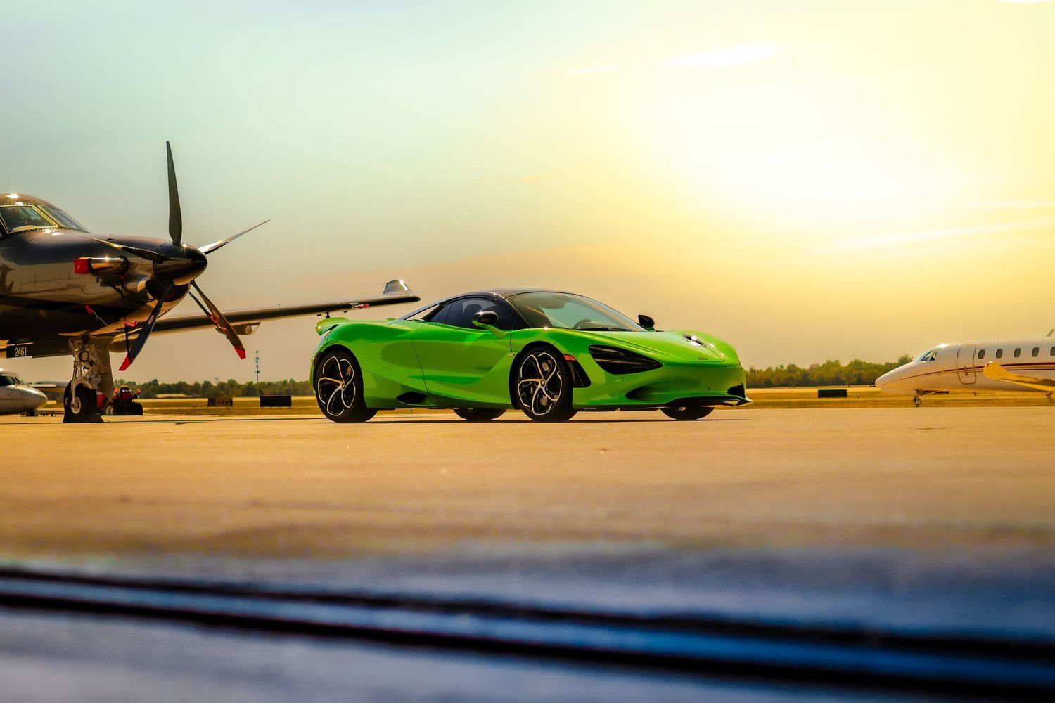 A bright neon green Lamborghini supercar sits parked in a dimly lit garage with dramatic lighting.