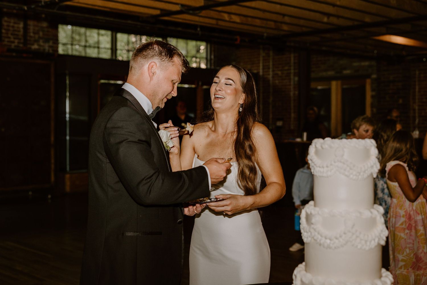 Industrial chic wedding reception at The Mill & Mine, Knoxville wedding photos cake cutting