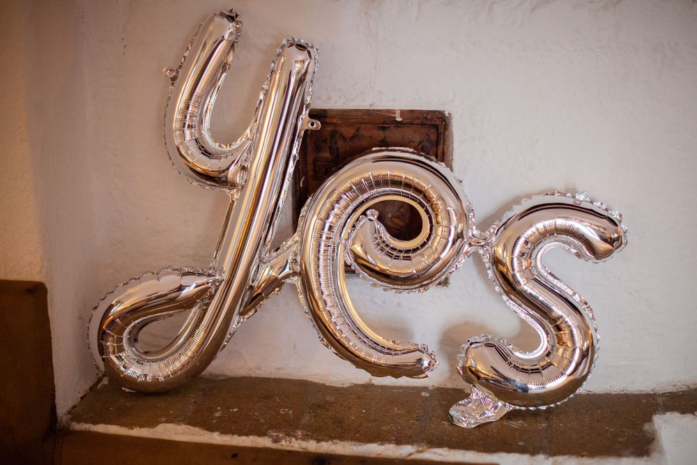Vintage decorative architectural elements with ornate scrollwork against a white wall.