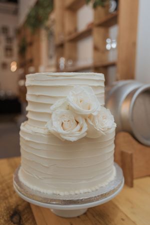 Simple elegant wedding cake by Little Bear Bakery at Tire Shack Brewery, modern luxury wedding photography Moncton New Brunswick elopement
