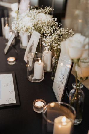 Elegant timeless black and white table decor at Tire Shack Brewery Moncton wedding photographer modern wedding decor by Purabellezza Design