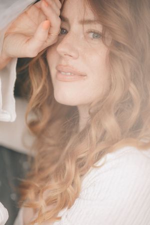 Soft portrait series showing blonde wavy hair and gentle expressions in dreamy, ethereal lighting.