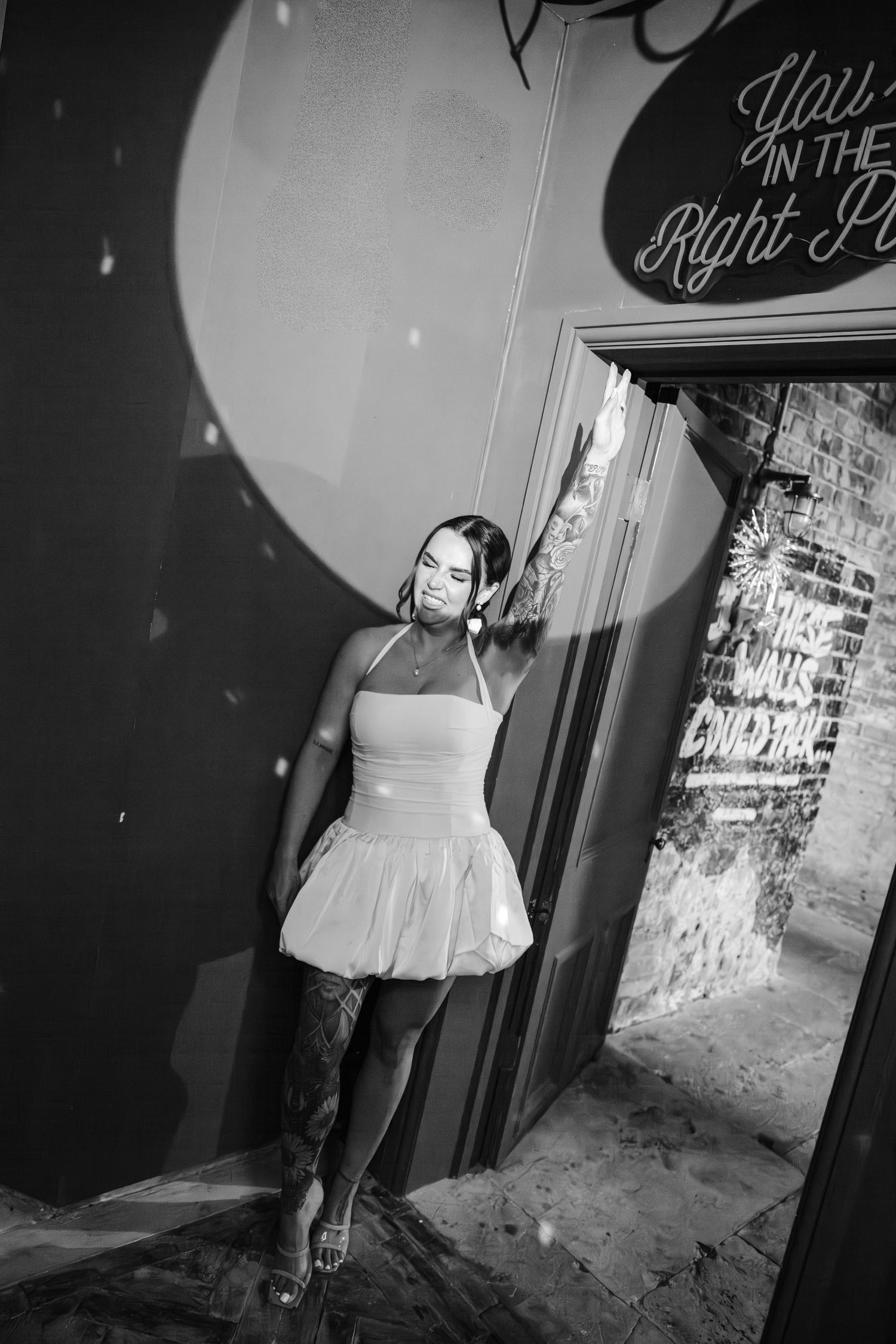 Black and white artistic photo series showing a person in a white tutu dress moving through a dark corridor.