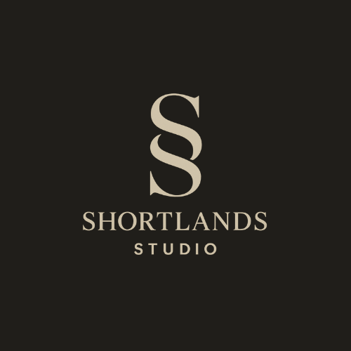 Minimalist black and white logo design for 'Shortlands Studio' featuring an elegant letter S against dark background.