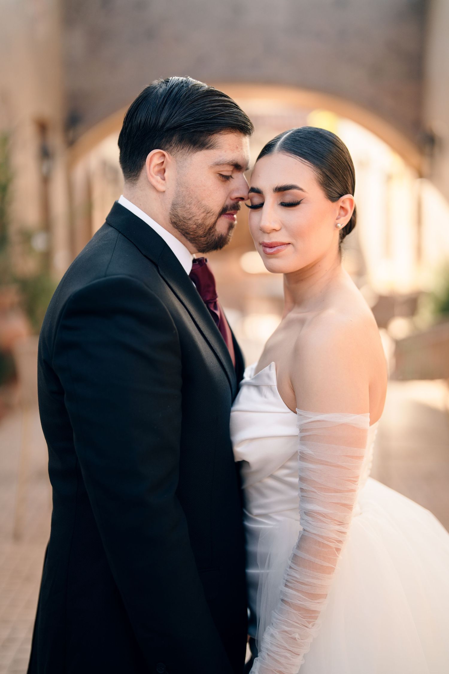 Romantic wedding portrait with soft lighting and intimate poses.