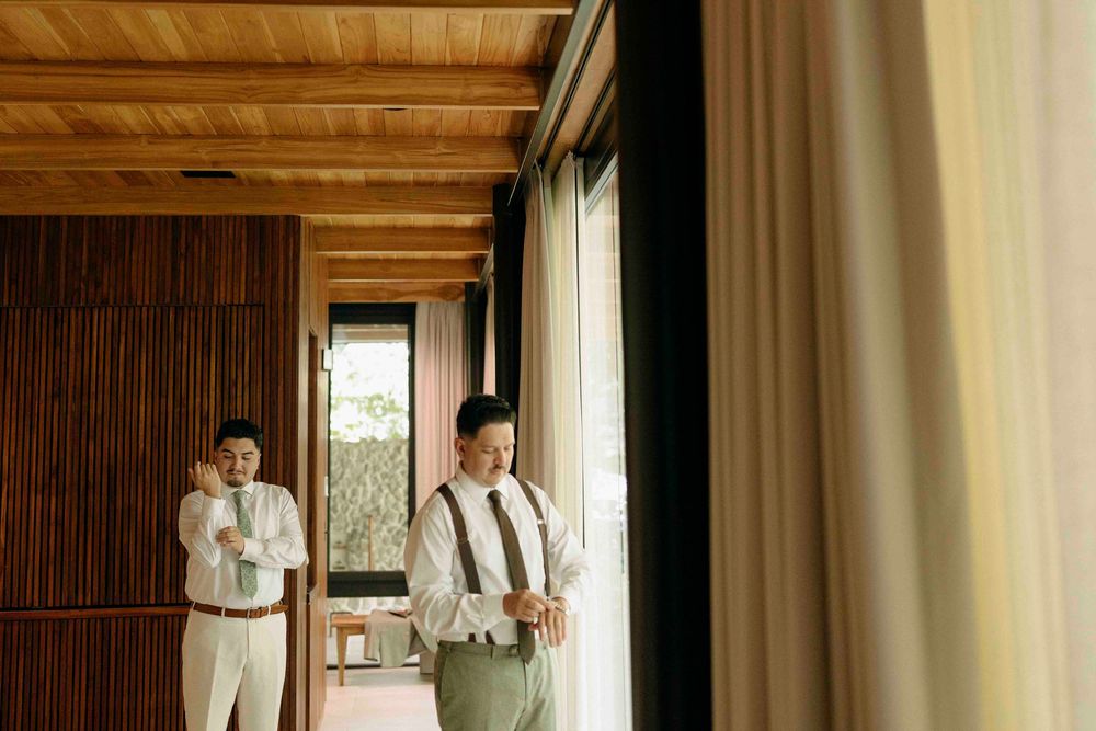 Groom putting on jacket before Costa Rica elopement ceremony.