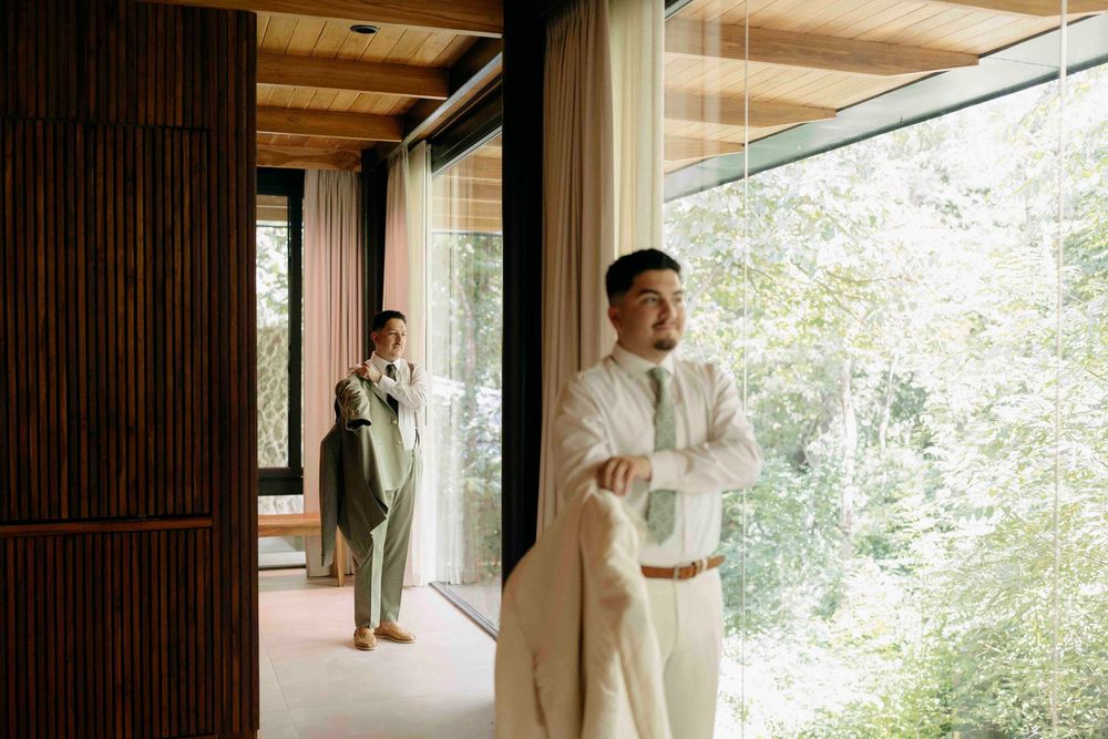 Candid pre-ceremony laughter during gay wedding morning in Costa Rica.