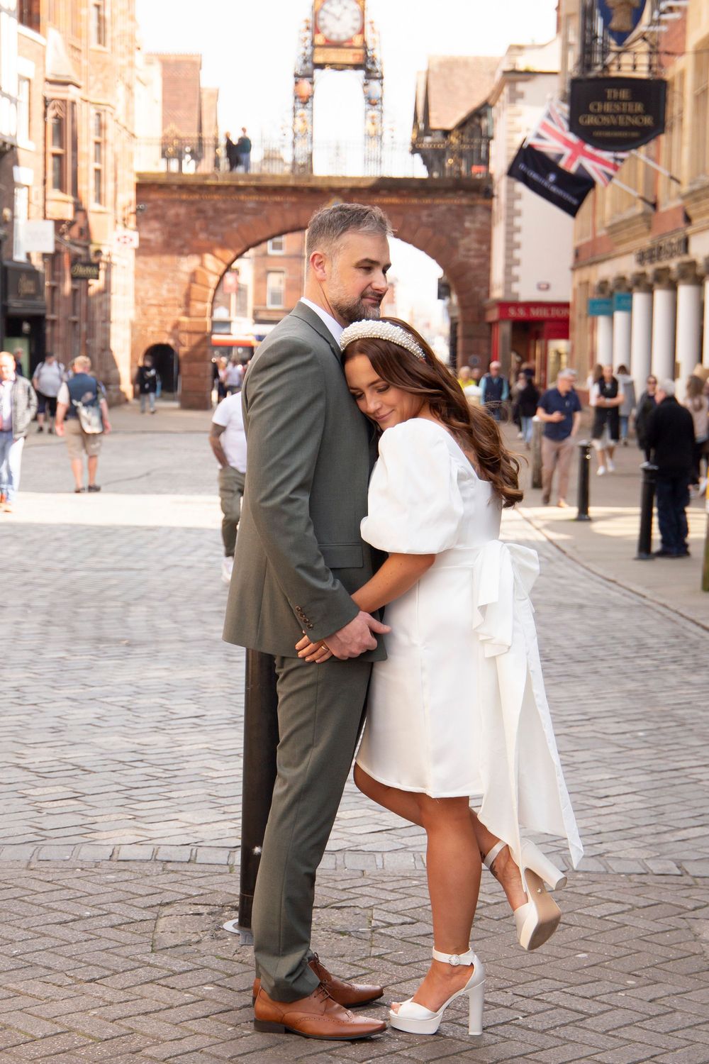 Bride and groom portraits in Chester city centre Eastgate alternative bride and groom wedding