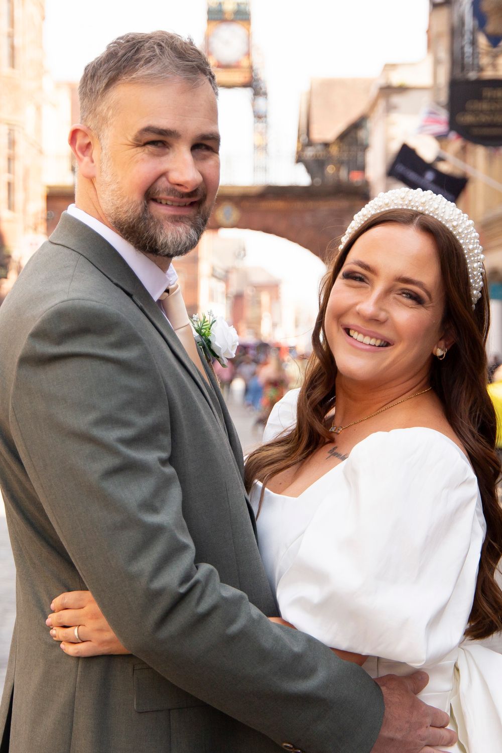 Bride and groom portraits in Chester city centre Eastgate alternative bride and groom wedding