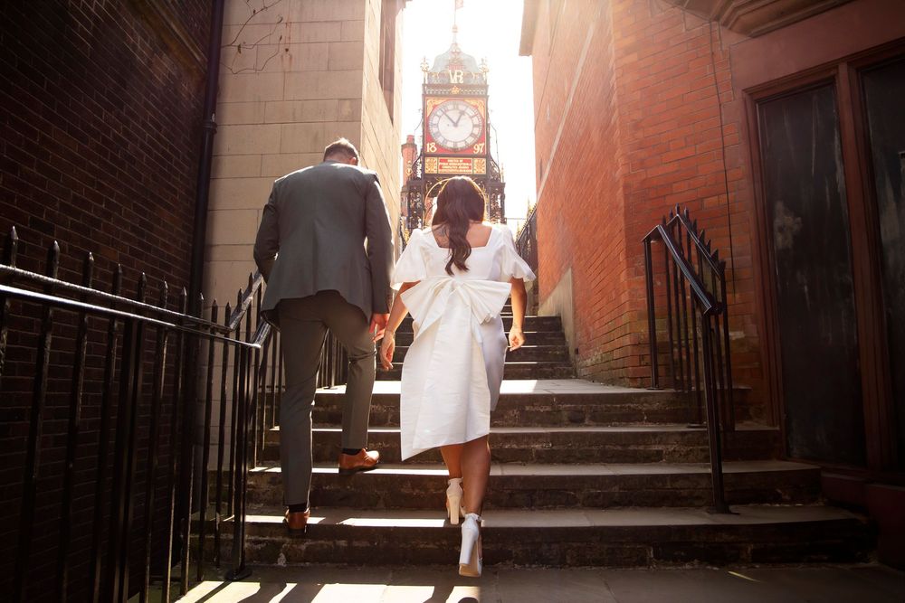 Bride and groom portraits in Chester city centre Eastgate alternative bride and groom wedding